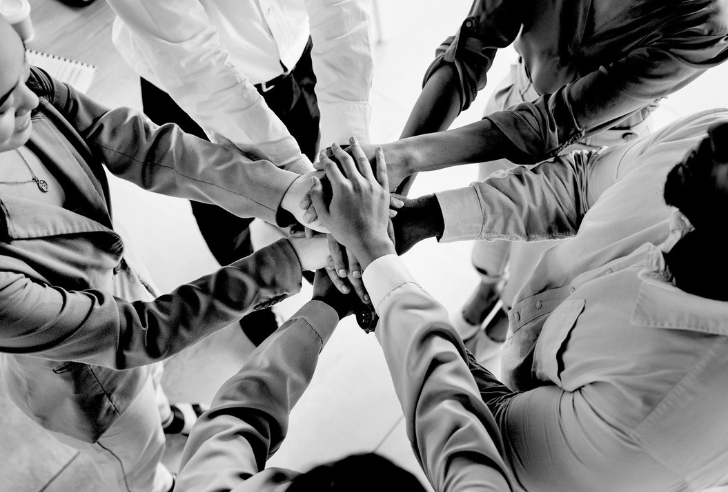 Team hands joined in collaboration